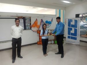 Vishal Upadhye, HR Head giving Award to employee.
